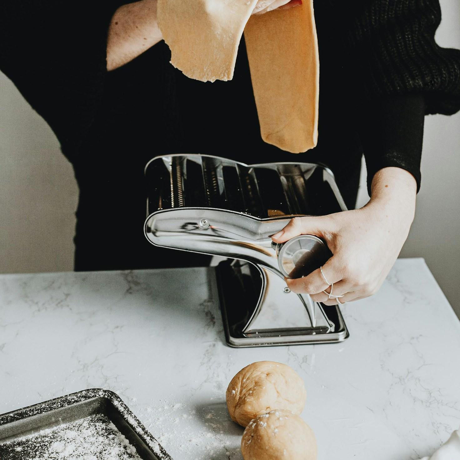 Community members collaborating in a modern kitchen space, exchanging recipes and cooking techniques